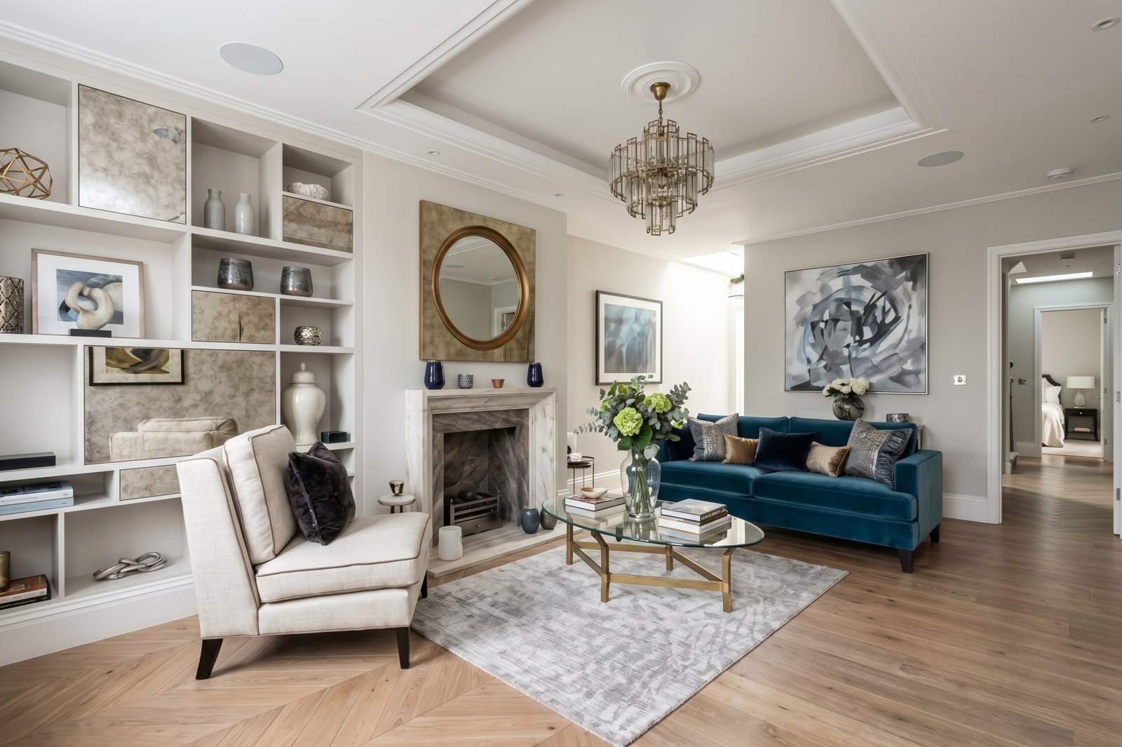 Bright living room with green velvet sofas